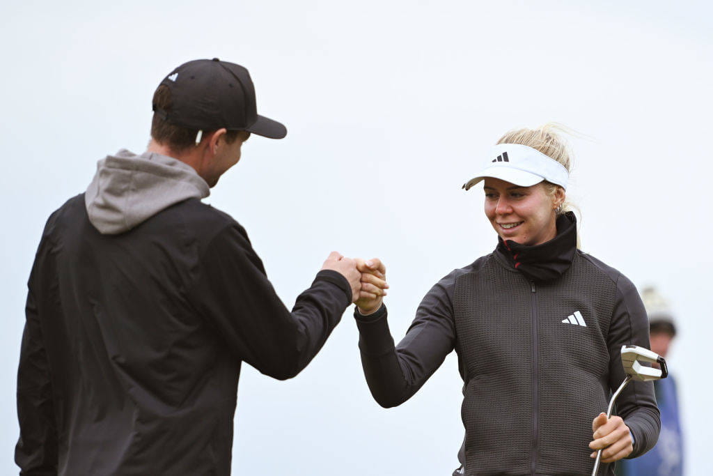 Annabell Fuller (r) fist bumps her caddie after qualifying for the 2024 AIG Women